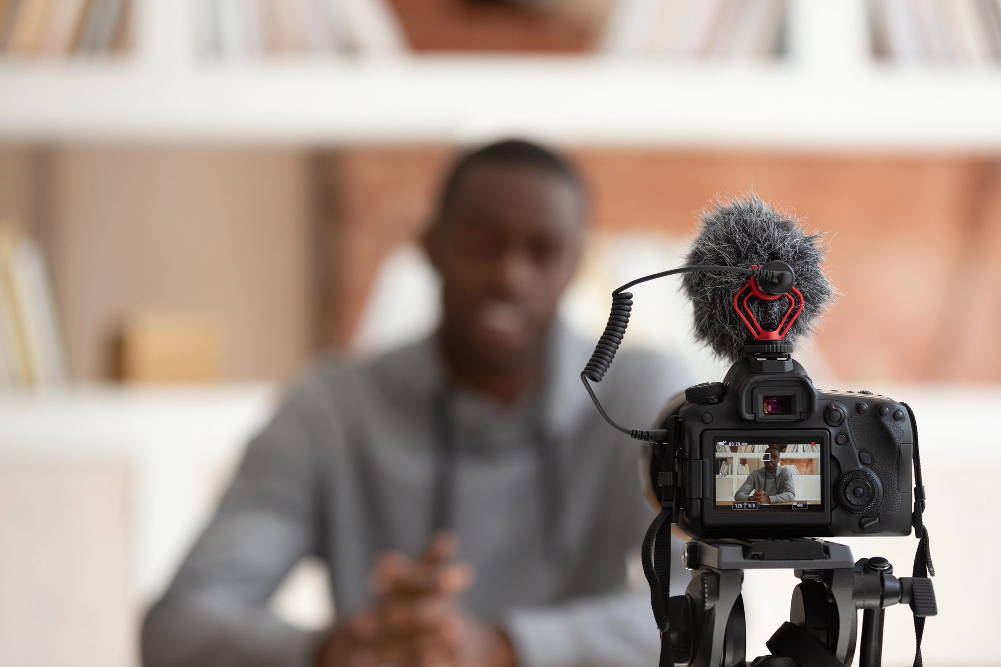 Vlogger sitting in front of a video camera. Orlando Video Production Company, NG Production Films